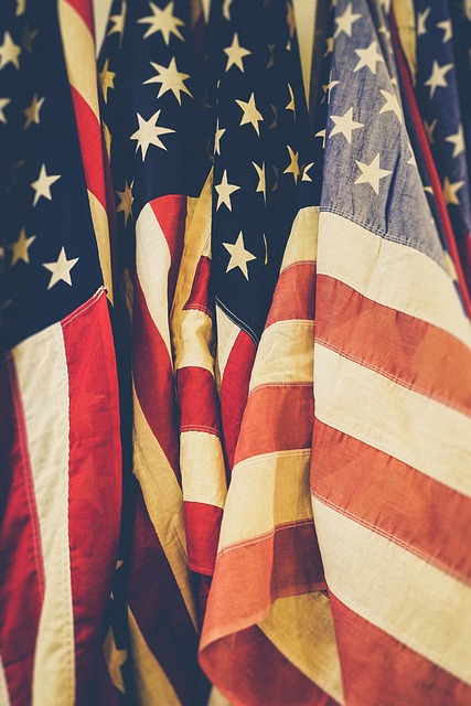 A row of american flags hanging on a wall